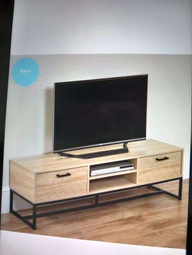 Preview of the first image of Unopened Long herringbone TV stand.