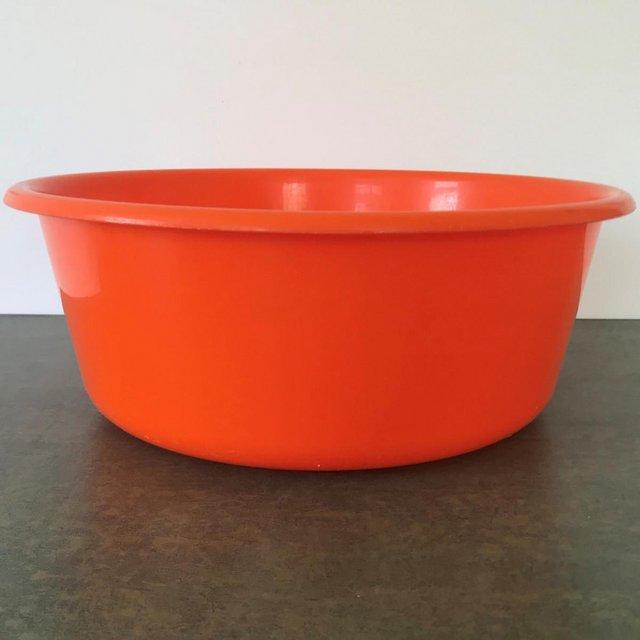 Preview of the first image of Vintage 1970's orange round plastic washing up bowl. Solray..