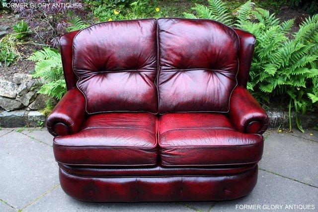 Preview of the first image of SAXON OXBLOOD RED LEATHER CHESTERFIELD SETTEE SOFA ARMCHAIR.