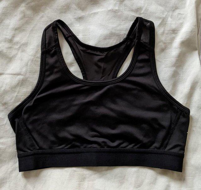 Preview of the first image of H&M Ladies Black M | Light Support Sports Bra.
