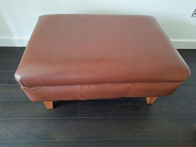 Preview of the first image of Leather upholstered footstool.