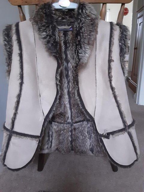 Preview of the first image of Fur lined suede jacket size 10.