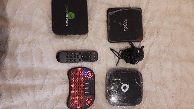 Image 2 of 3 android boxes with 2 remotes