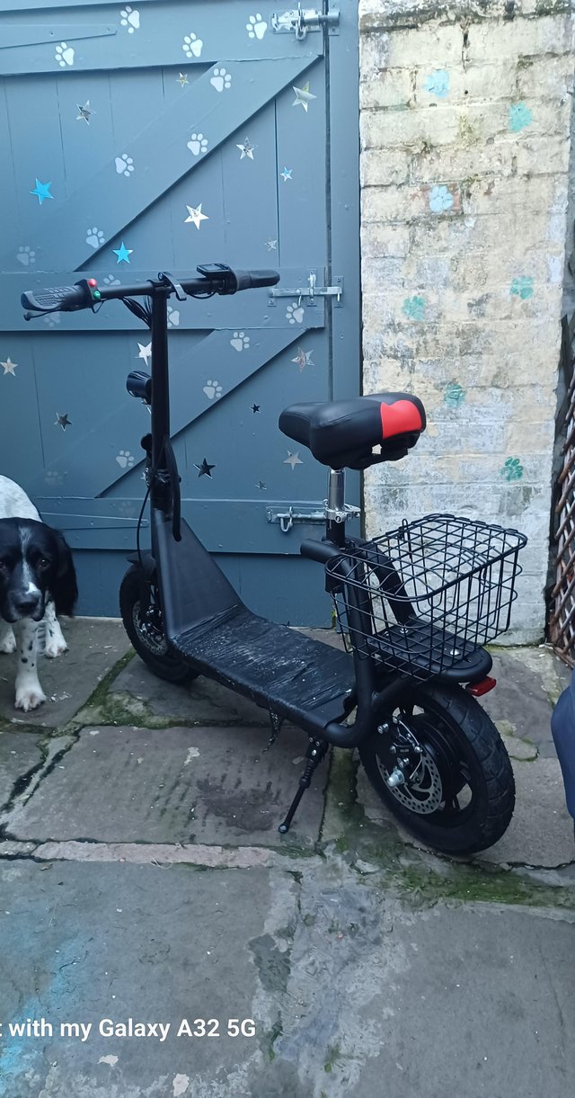Preview of the first image of Sit and ride on E scooter.