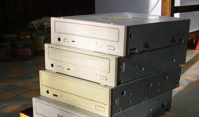 Preview of the first image of Three vintage CD drives from the 1990s.