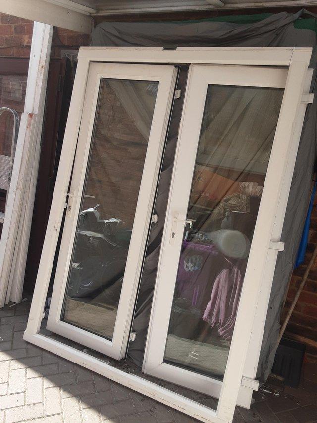 Preview of the first image of Pvc french doors mint like new.