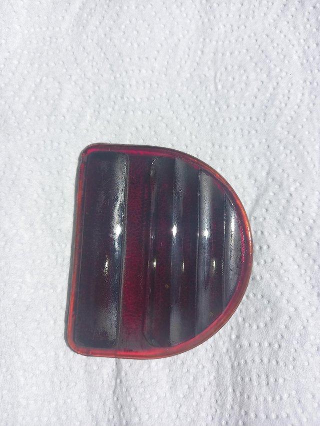 Preview of the first image of Rear ruby red glass D light lens.