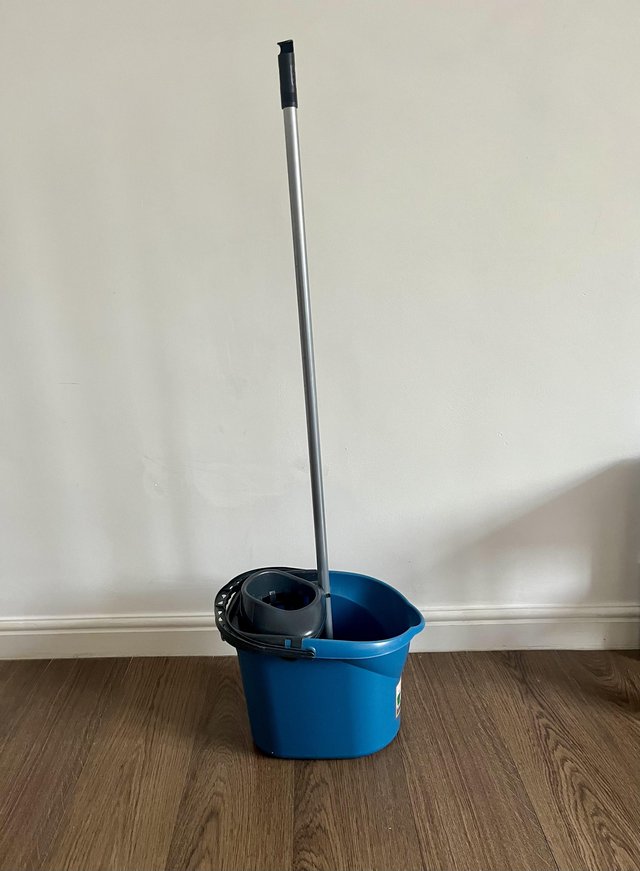 Preview of the first image of Mop bucket with wringer + mop/Broom stick.