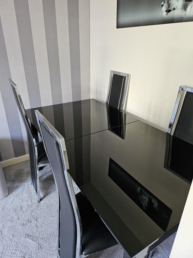 Preview of the first image of Black and chrome extendable dining table and 4 chairs,.