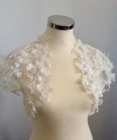 Image 1 of Bridal lace bolero in pale ivory with guipure motifs
