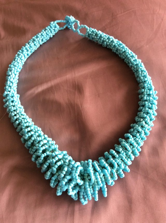Preview of the first image of Graduated turquoise small bead necklace.