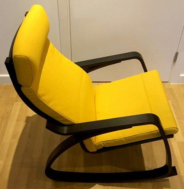 Preview of the first image of IKEA POÄNG ROCKING-CHAIR, Black, yellow cushion.