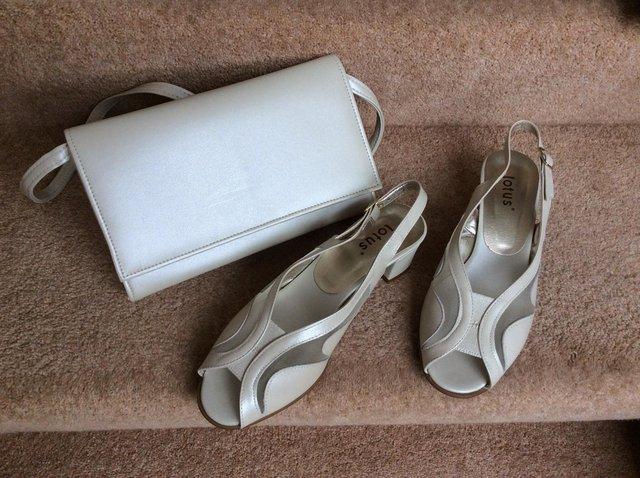 Preview of the first image of Lotus Ladies Shoes 5D & Matching Bag in Cream.