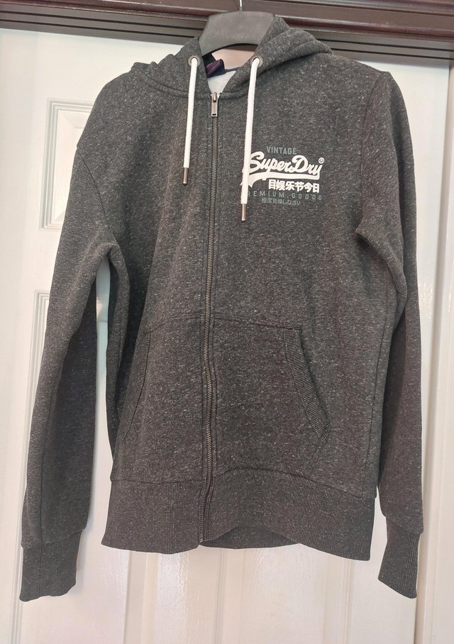 Preview of the first image of Superdry zip up hoodie size large.