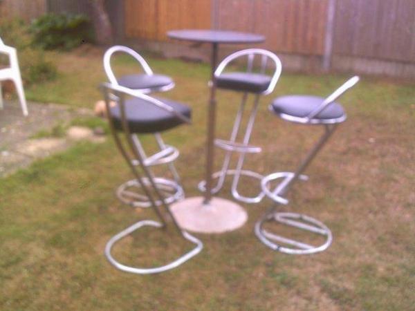 Image 3 of black revolving table and 4chairs