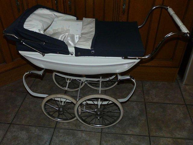 Preview of the first image of SILVER CROSS TRADITIONAL DOLLS PRAM.