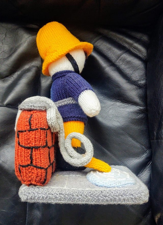Preview of the first image of A Hand Knitted Free Standing Fireman.