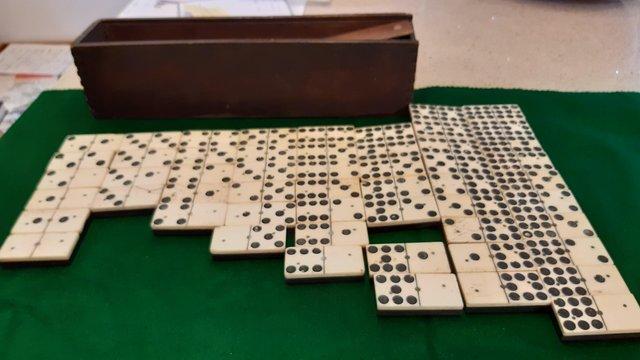 Preview of the first image of Antique Dominoes set of double 9s.