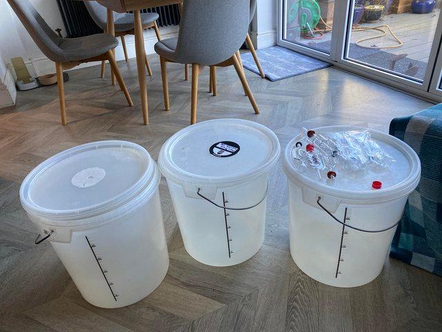 Preview of the first image of Brewing Buckets with lids and air locks x 3.