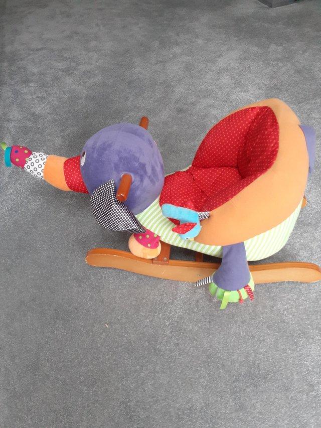 Preview of the first image of Sit on Rocker Elephant brightly coloured.