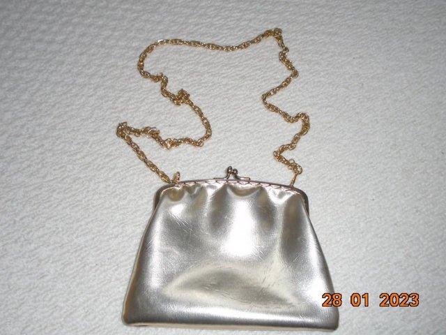 Preview of the first image of Vintage 1960s gold coloured handbag with gold chain.