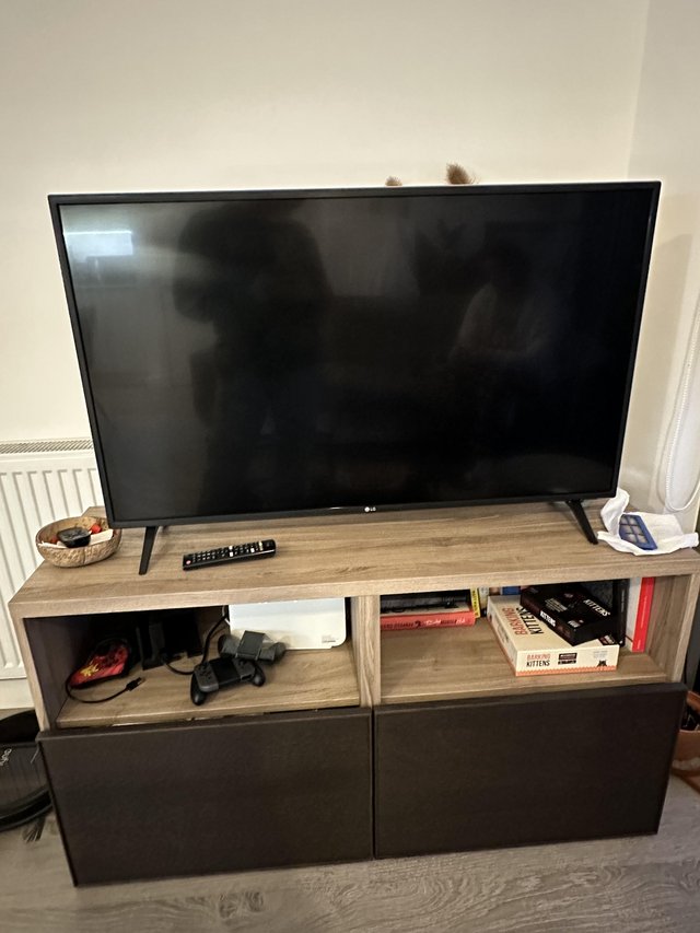 Preview of the first image of IKEA customised TV stand with two spacious sliding drawers.
