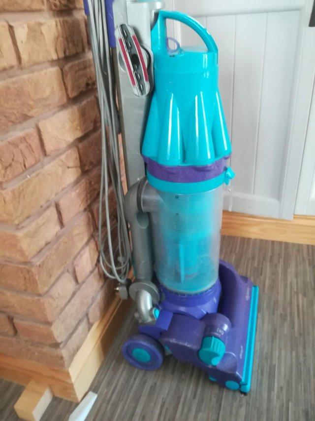 Preview of the first image of DYSON DC07 CORDED CLEANER COLOUR PURPLE AND GREEN.