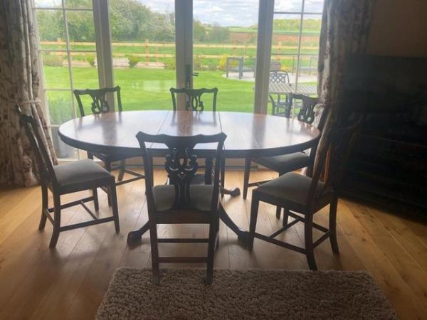 Image 1 of Solid oak dining table and chairs