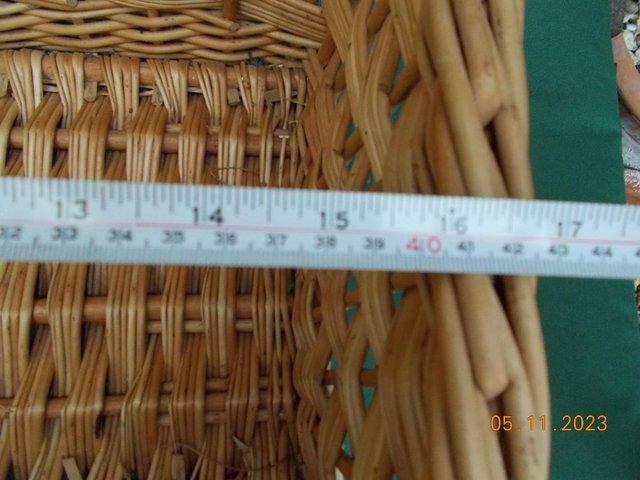 Preview of the first image of Wicker basket with a handle in excellent condition.