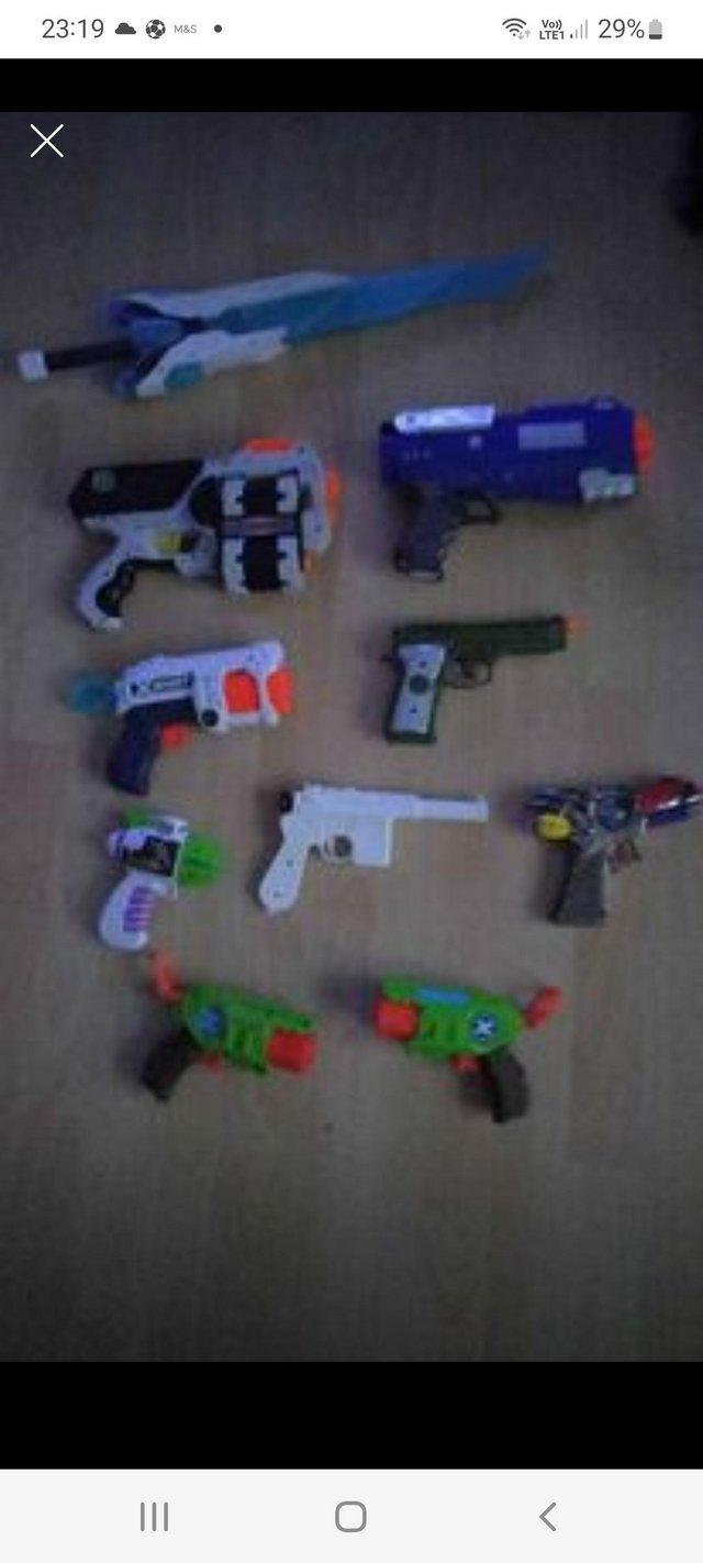 Preview of the first image of 9 plastic toy gun assortment & 1 sword..