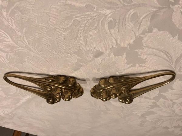 Image 1 of Curtain holdbacks in solid brass.