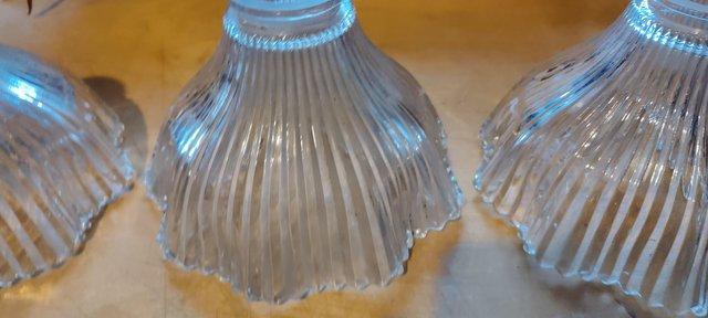 Preview of the first image of Vintage fluted holophan glass shades.