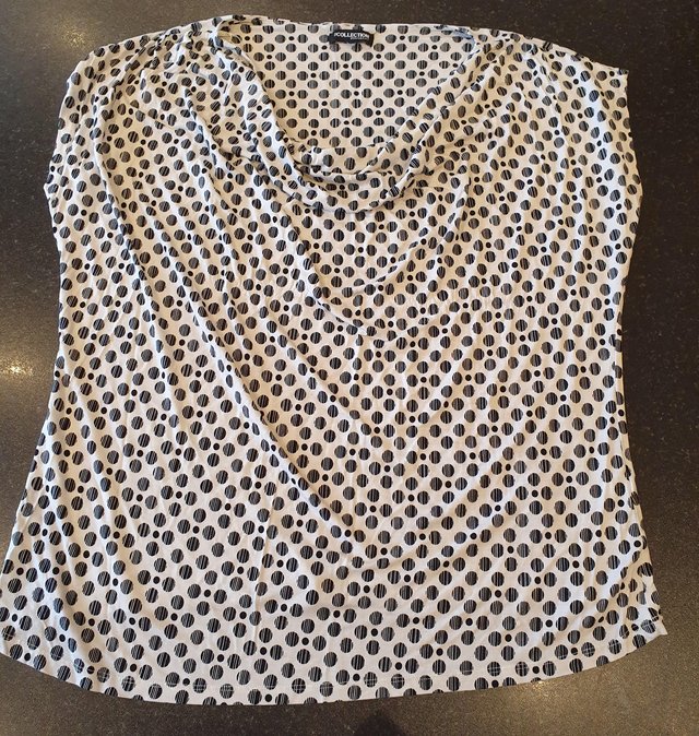 Preview of the first image of Plus size white with black dots cowl neck top, size 22.