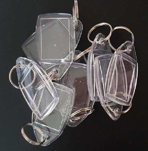Preview of the first image of 71 2 part clear plastic keyring blanks with metal loop.