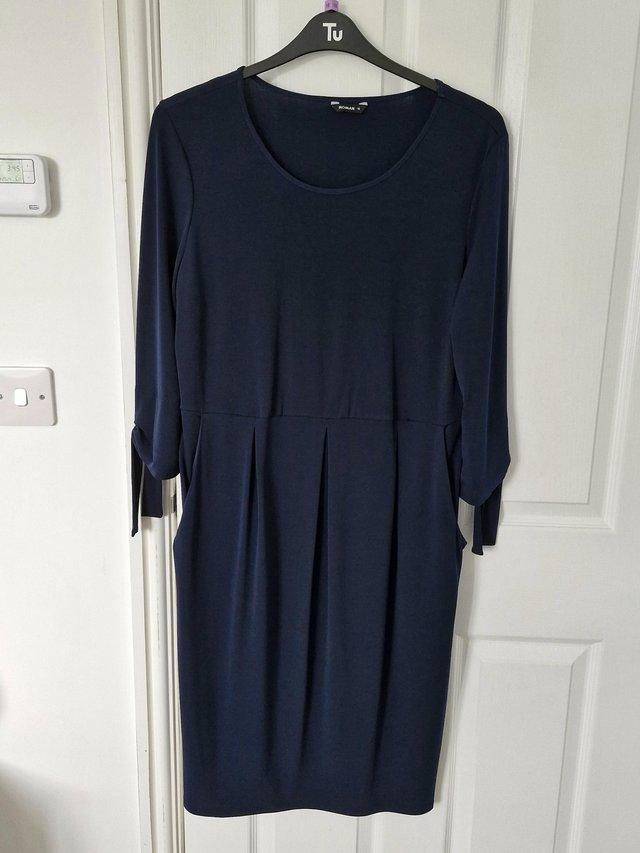 Preview of the first image of Lovely Navy Blue Round Neck Dress.