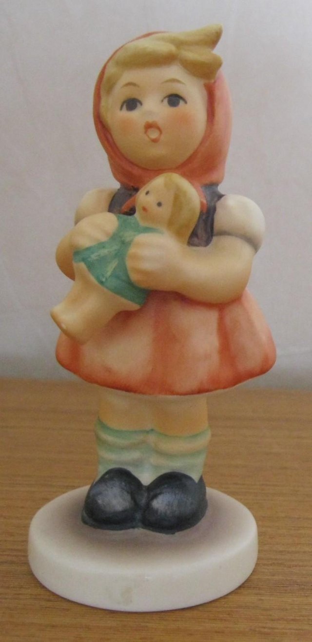 Preview of the first image of Vintage M J Hummel Figure - Girl with Doll. 9cm tall.