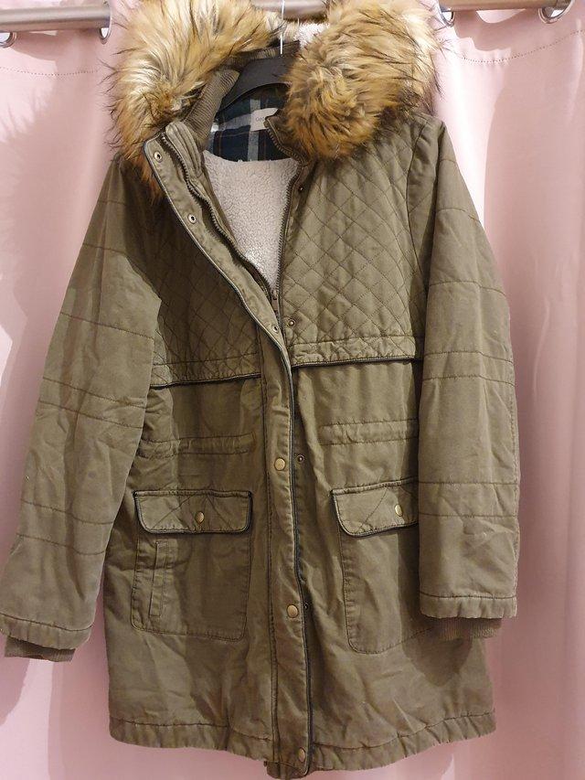 Preview of the first image of Khaki Parka Coat with detachable hood size 16.