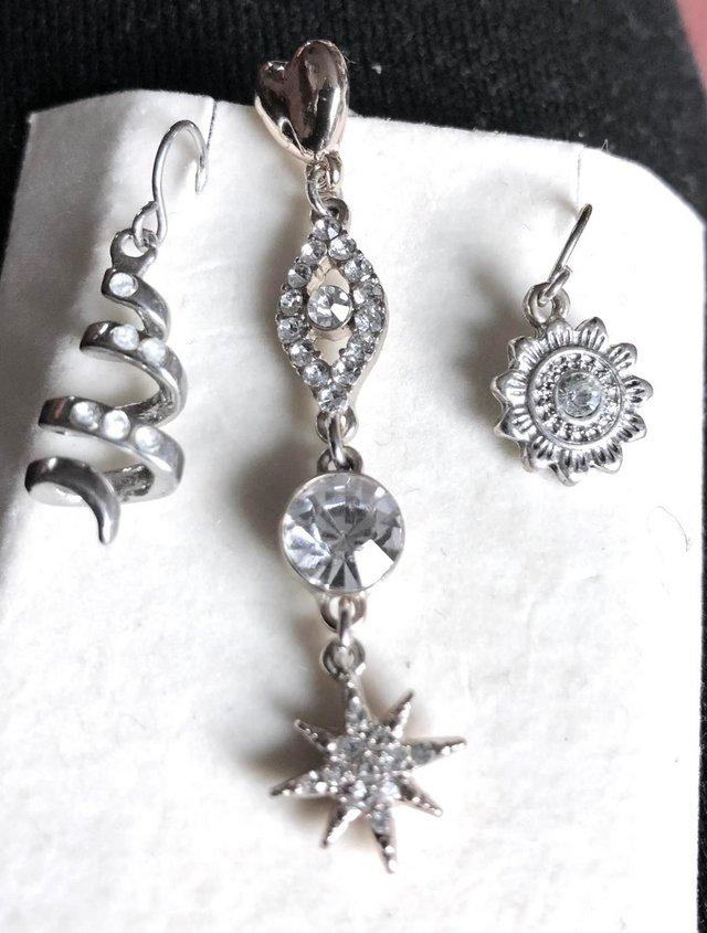Preview of the first image of THREE BEAUTIFUL ORNATE EARRINGS FOR PIERCED EARS.