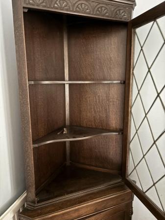 Image 2 of Dark wood corner cupboard with half glass door