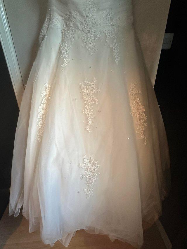 Preview of the first image of Wedding dress and veil for sale.