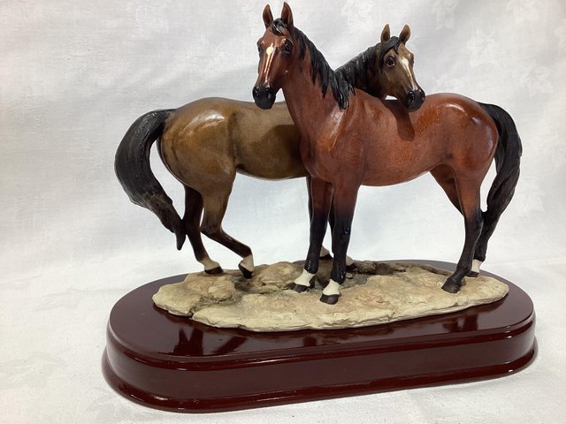Preview of the first image of Beautiful figurine of two thoroughbred type horses.
