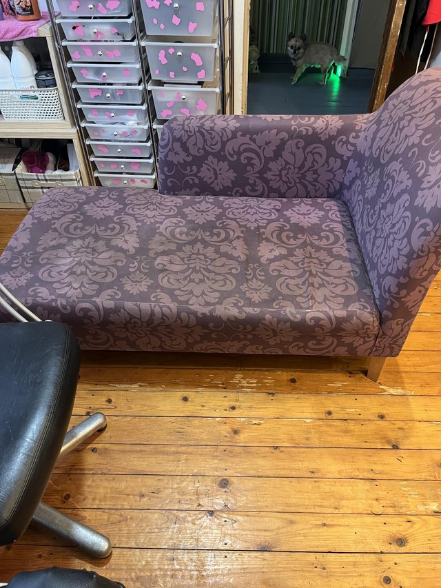 Preview of the first image of Dark purple chaise lounge small rip on back.