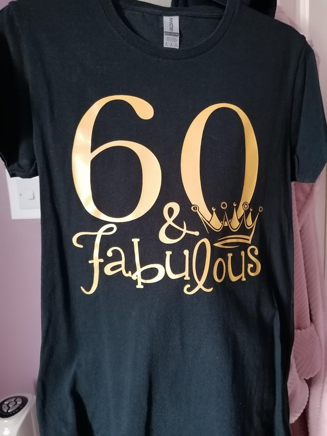 Preview of the first image of Black 60 T-shirt says 60 & Fabulous.