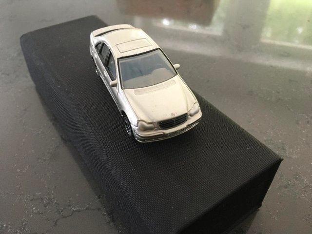 Preview of the first image of Two scale model collectible cars.