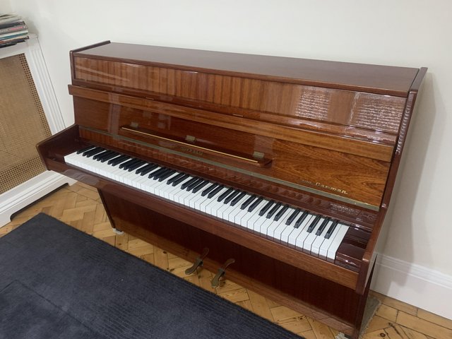 Preview of the first image of Hupfeld Carmen mahogany upright piano..