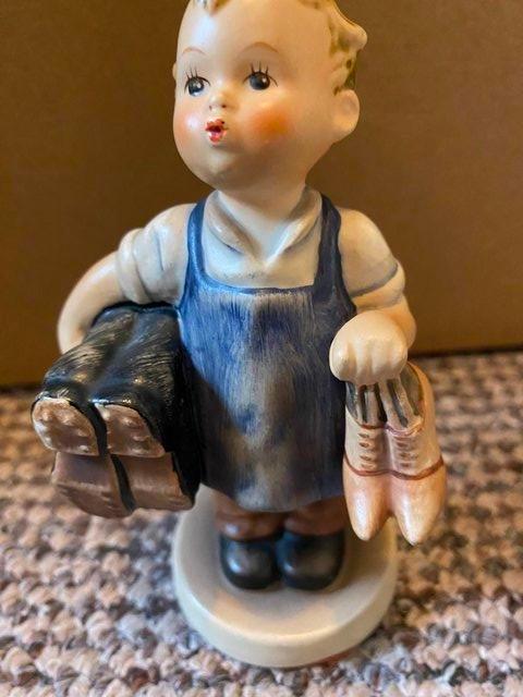 Preview of the first image of Vintage Hummel figure boy with shoes.