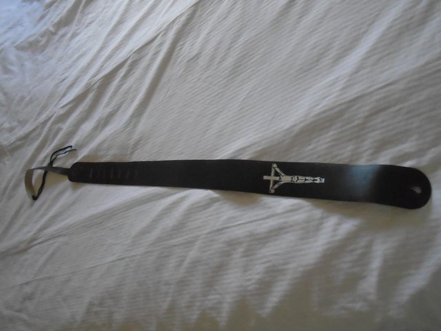 Preview of the first image of GUITARSTRAP - GENUINE LEATHER - With Christian Emblem.