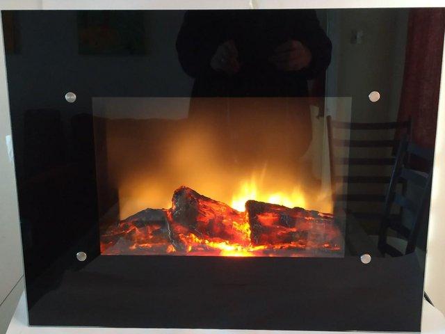 Preview of the first image of Electric Wall Mounted Fireplace with Fan Heater and Remote.