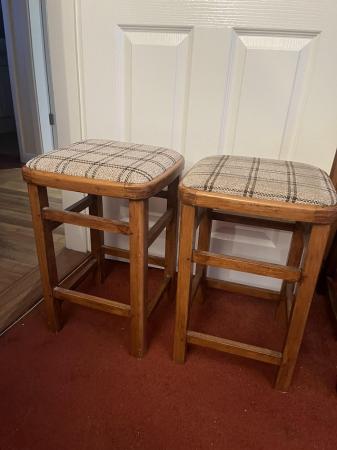 Image 1 of 2 small stools with brown and cream fabric seat.