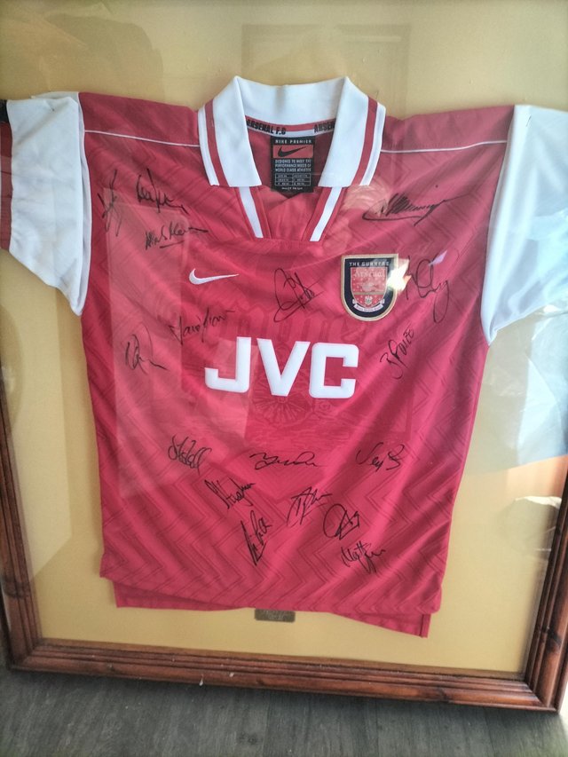 Preview of the first image of Arsenal squad Signed Shirt.